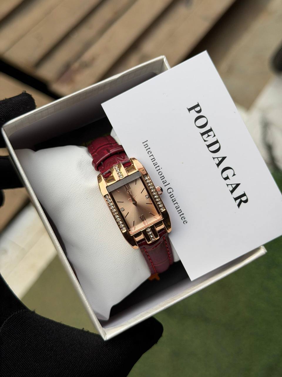 female wrist watch red leather gold face with stone